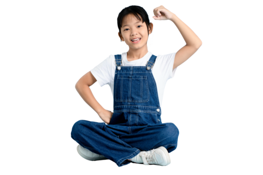 A young girl confidently flexing her arm, showcasing strength and vitality on PNG 