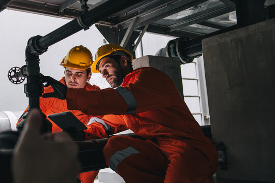 Two professional engineer male teamwork service maintenance, Worker industry water pipe tube system