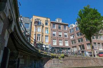 Amsterdam, Netherlands - July 02, 2018: Parking for bicycles on the embankment of Amsterdam