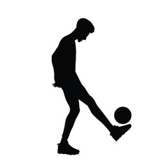 Silhouette of a Man Juggling a Soccer Ball