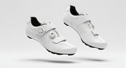 Pair of White Cycling Shoes Floating on a Clean White Background