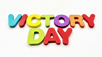 Colorful Wooden "VICTORY DAY" Sign on a White Background