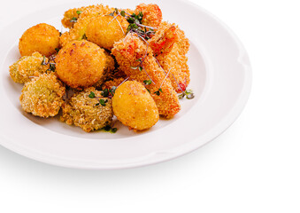 Crispy fried snacks served on a white plate with herbs and seasonings