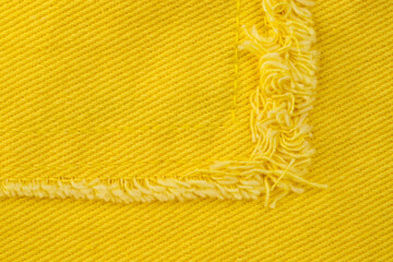 denim shirt made of yellow fabric with fringe, clothing details