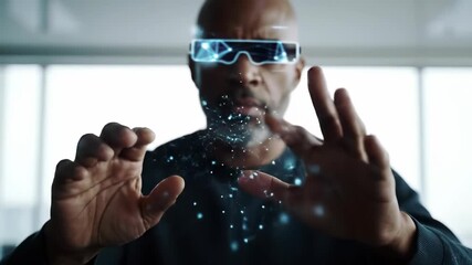 Augmented reality future: A bald African American man wearing smart glasses interacts with digital holographic data in a modern office, symbolizing virtual technology innovation and the metaverse. - Powered by Adobe