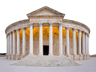 Fototapeta premium Ancient stone Roman temple architecture column historic classical building landmark structure with grand columns and illuminated entrance evokes awe and admiration