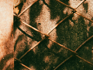 Rusty metal grid over an old wooden surface