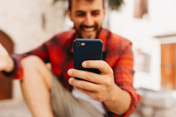 Close up view of man using smartphones