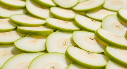 Vibrant green pear slices create a fresh, healthy, and natural background for culinary use