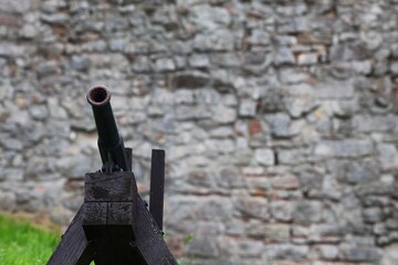 Medieval Cannon in front of Stone Wall