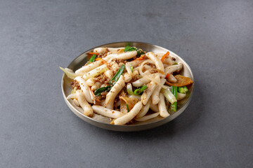 Korean traditional food with gray background, royal tteokbokki 회색배경의 한국 전통음식인 궁중 떡볶이