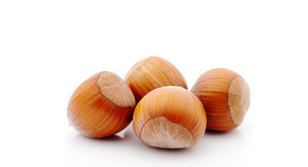 Pile of hazelnuts on a white background