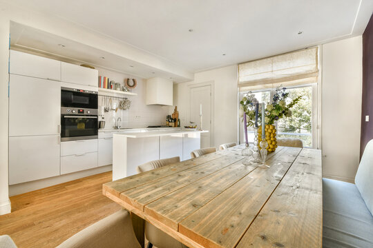 Modern kitchen interior with rustic dining table