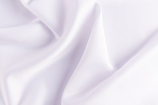 Naklejki Elegant draped satin fabric background in soft white tones
