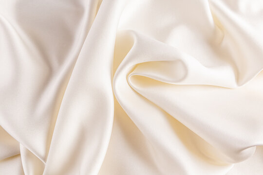 Luxurious satin fabric background with elegant folds
