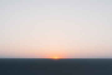 Blurred Sunset Over Horizon