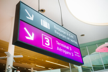 Airport terminal sign guiding to baggage and exit
