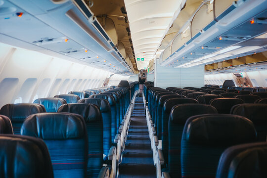 Interior view of empty airplane cabin with seats