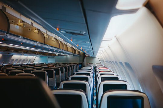 Interior view of commercial airplane cabin seating