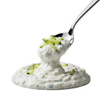 Gleaming silver spoon pulling away from a creamy Greek tzatziki dollop with visible cucumber and dill, isolated on transparent background with raking light creating intricate textures, concept of