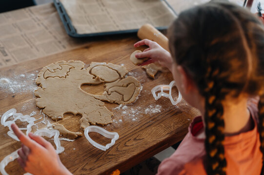 Young girl engaged in halloween-themed baking activities
