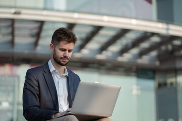 businessman holding laptop.Office worker at business center.