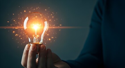 Bright Incandescent Light Bulb Held In Hand Sparking With Energy