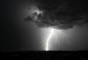 a dark stormy sky with a spiral of lightning