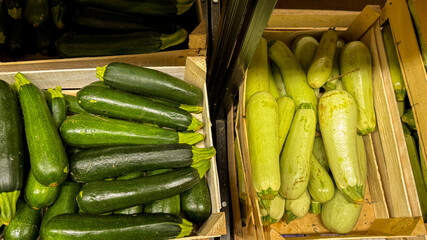 Crates of vibrant zucchinis whisper tales of summer solstice feasts and verdant abundance, evoking...