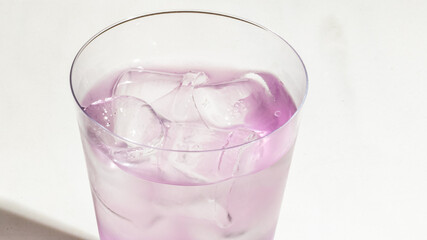 Chilled lavender elixir in frosty glass, embracing mystic wellness, Purple Day tranquility, and Mediterranean herbal traditions