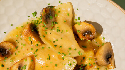 Golden mushroom pierogi glisten under midsummer sun, evoking Slavic culinary tales, perfect for a cozy Lammas supper