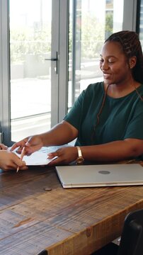 Vertical video: Signing contract African American woman shaking hands, exiting office, copy space