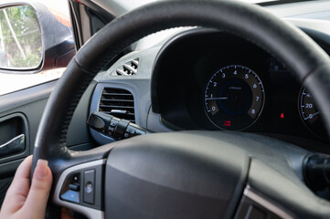 CloseUp Detailed View of the Steering Wheel Featuring Dashboard Indicators Clearly Displayed