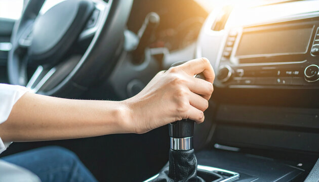 A person driving a car, shifting gears with focused attention. The sun is shining and creating a sense of mobility. - Powered by Adobe