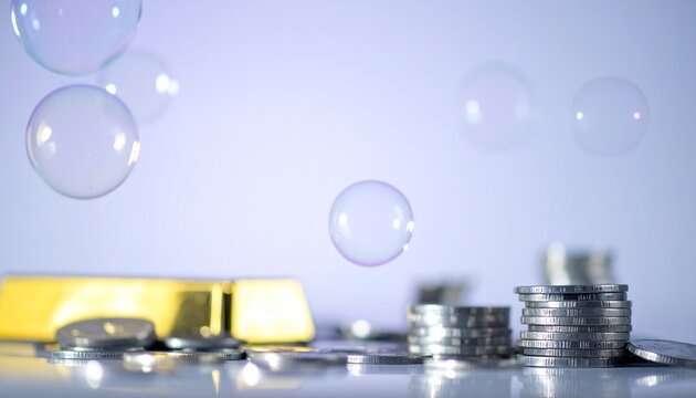 Financial bubble concept with gold bar, coins, and soap bubbles, implying economic instability