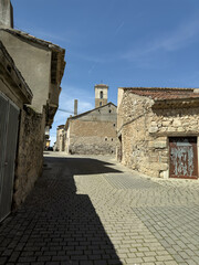 Old stone houses and arch in the historic center of Vertavillo, Palencia