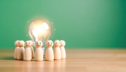 A lightbulb surrounded by a group of small wooden figures, representing a collaborative brainstorm session. It suggests ideas, innovation and teamwork 