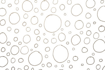 Close up of hand drawn doodle pen circle spirals and spots and dots on white background