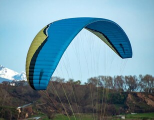 Paraglider soaring over a landscape