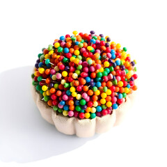 Colored pinheads of various hues and shapes dense