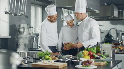Three  Chefs collaborate in a Modern Kitchen, Using a Digital Tablet to Browse Online Menus and Order Fresh Ingredients, Culinary Creativity With Innovative Ecommerce Technology for Meal Planning