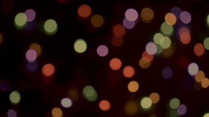 real life multicoloured bokeh with a dark black background as the camera passes over defocussed multi-coloured fairy lights softly twinkling in various sequence patterns 4K - Powered by Adobe