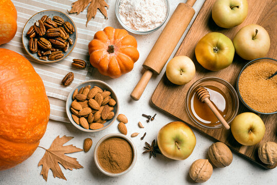 Autumn fall baking background with pumpkins and ingredients