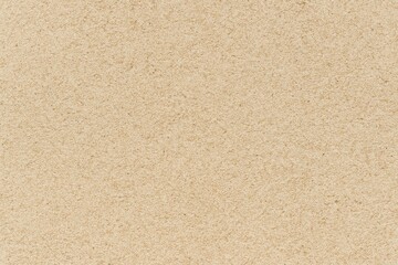 Fototapeta premium Fine Beige Sand Texture Background in Horizontal Orientation, Natural Grainy Surface for Beach, Summer and Travel Design