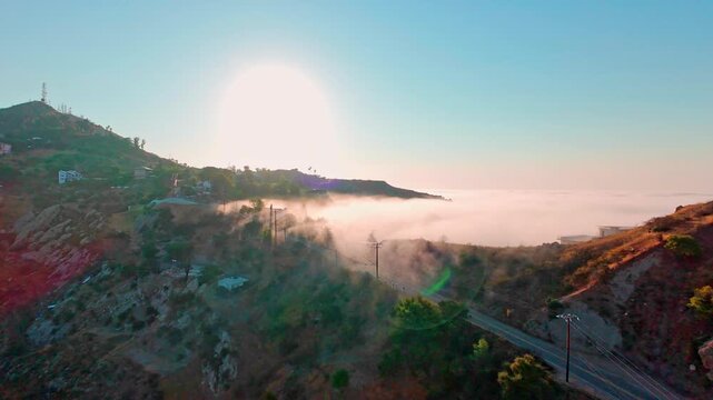  Malibu Hillside Homes Above the Clouds &mdash; Aerial of luxury real estate in Topanga with a sea of clouds below