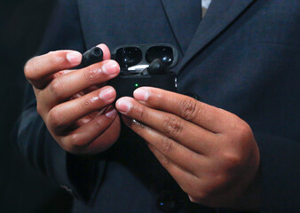 A Detailed Close-up of a Hand Wearing a Pristine White Rubber Glove Delicately Holding a Clear, Ornate Glass Cup, an Image That Powerfully Conveys the Concepts of Purity, Hygiene