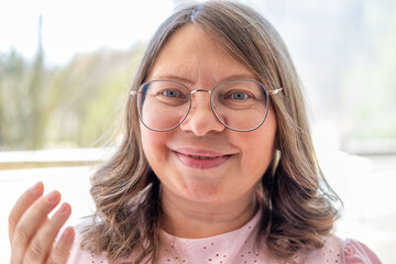 Mature woman 50 years old wearing glasses, poor vision, myopia problem, optical exam, diopter...