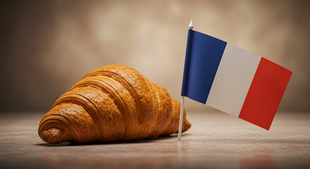 Crispy Golden Croissant Beside Miniature French Flag on a Textured Surface