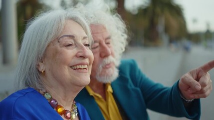 Cheerful elderly couple sharing tender moment during scenic seaside vacation, radiating genuine love, joy, and deep emotional connection in golden years