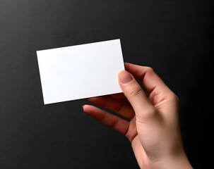 A business card blank in hand, ready for customization. Perfect for branding, networking, or marketing. Simple, elegant design against a dark background.